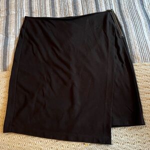 Cabi black knit asymmetrical skirt; side zipper; great condition size 10